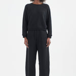 The Arc Lounge Pant in black. On body front - Jamie Haller