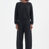 The Arc Lounge Pant in black. On body front - Jamie Haller