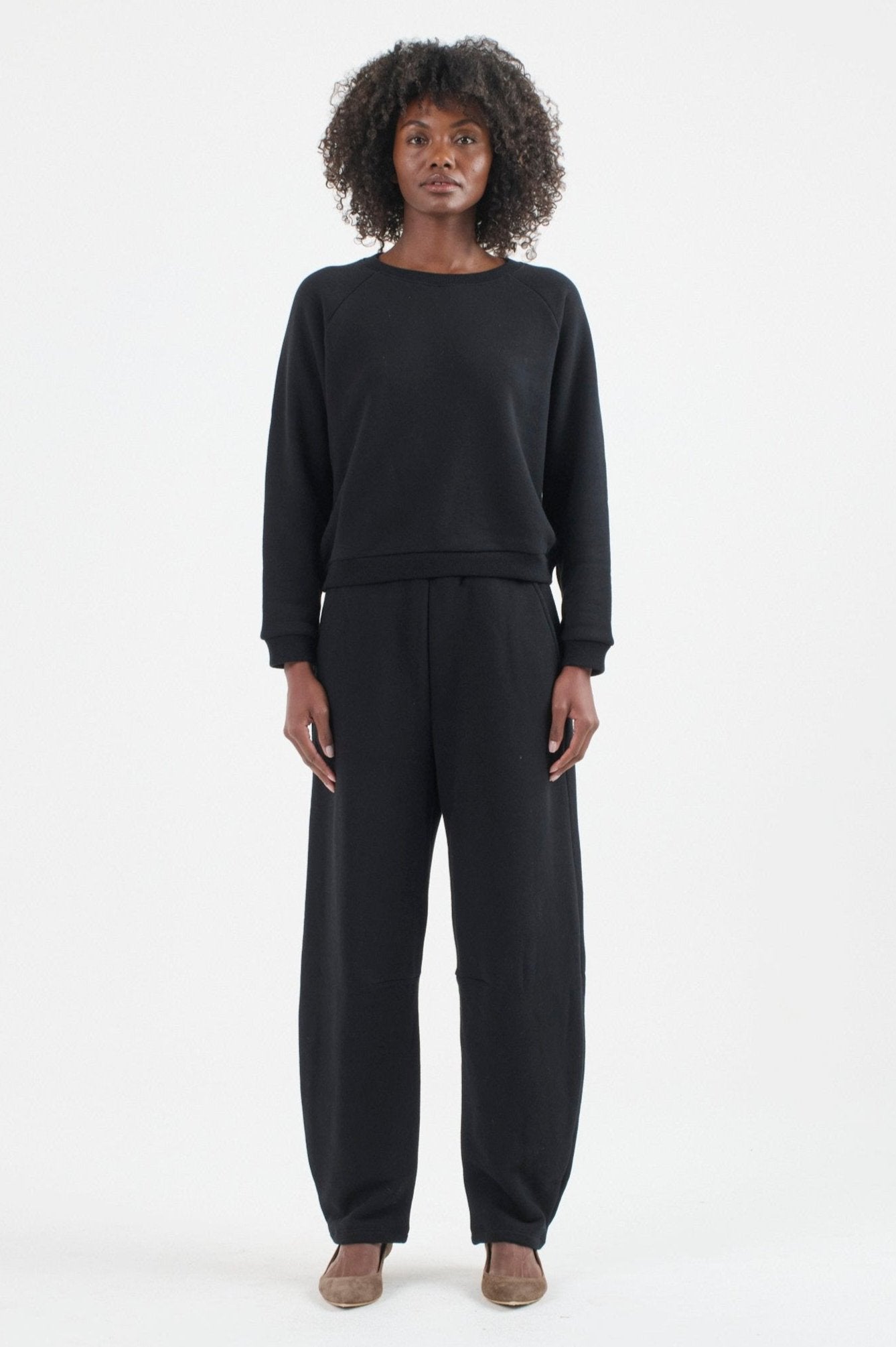 The Arc Lounge Pant in black. On body front - Jamie Haller