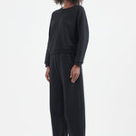 The Arc Lounge Pant in Black. On body front side - Jamie Haller
