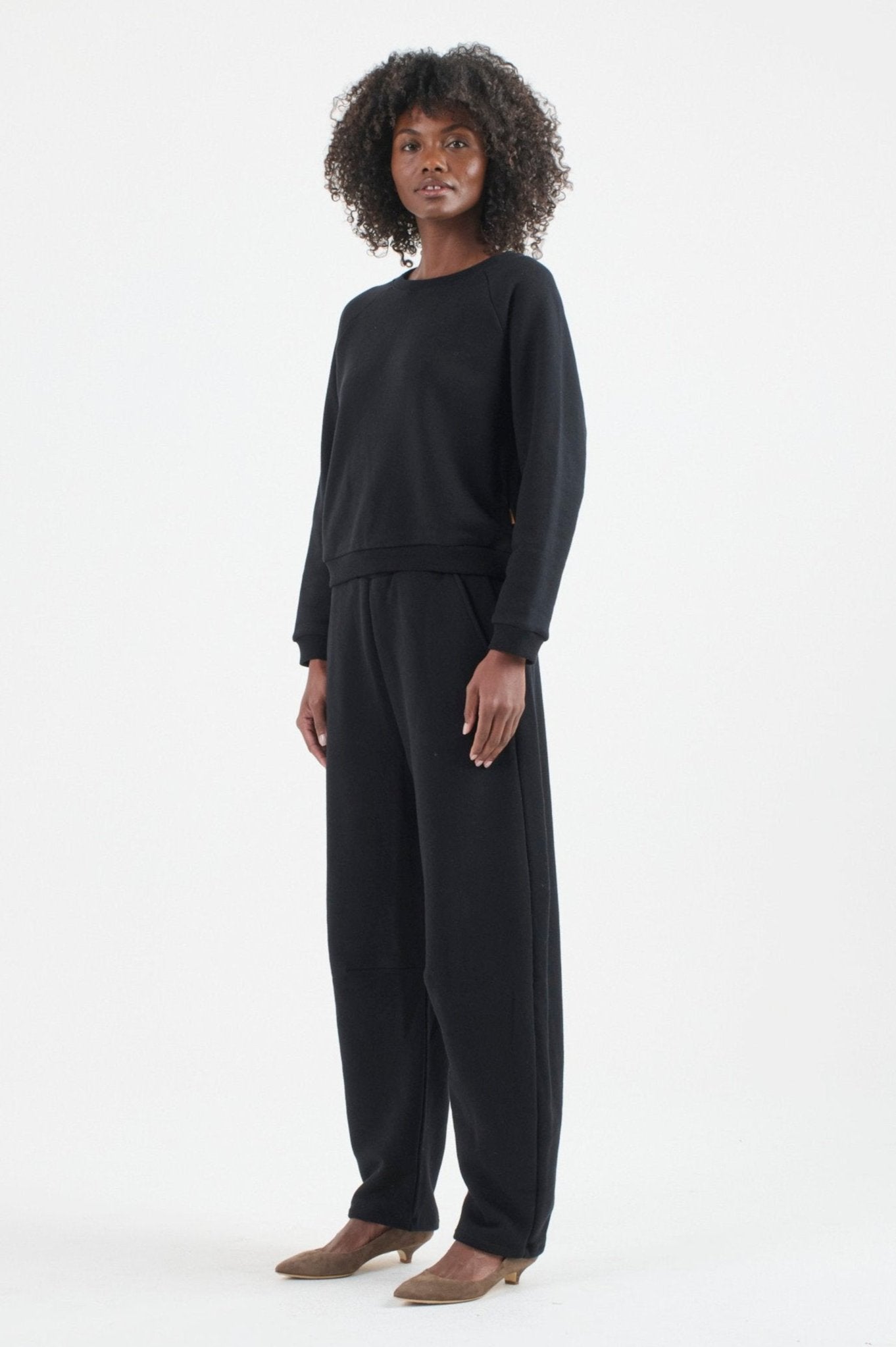 The Arc Lounge Pant in Black. On body front side - Jamie Haller
