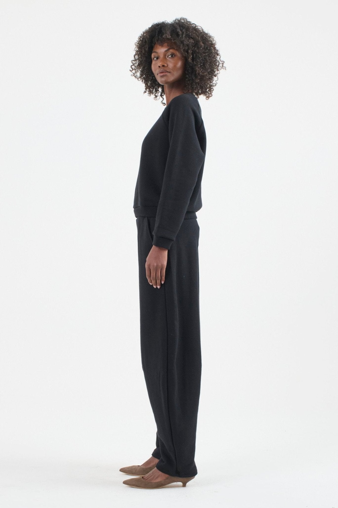 The Arc Lounge Pant in black. On body side - Jamie Haller