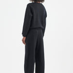The Arc Lounge Pant in black. On body back side - Jamie Haller