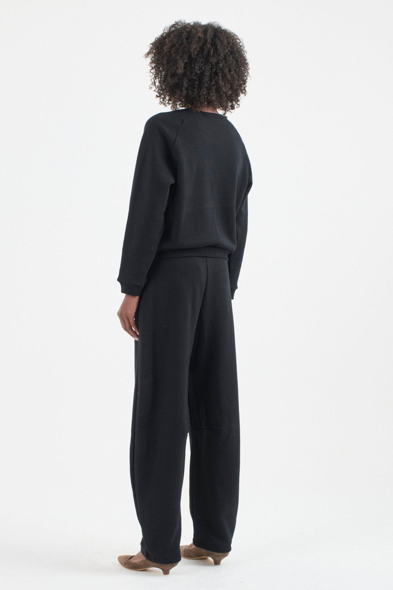 The Arc Lounge Pant in black. On body back side - Jamie Haller
