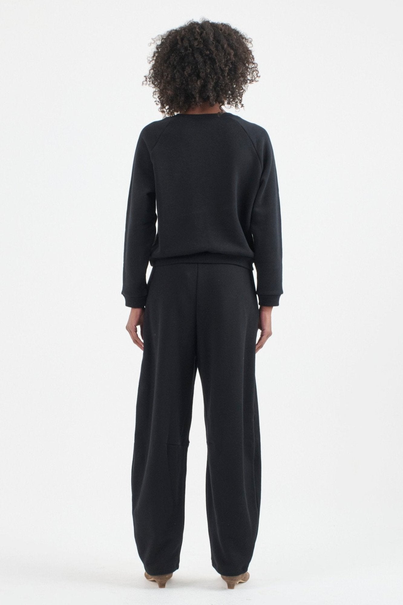 The Arc Lounge Pant in black. On body back - Jamie Haller