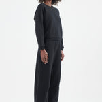 The Arc Lounge Pant in black. On body front side - Jamie Haller