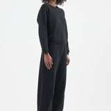 The Arc Lounge Pant in black. On body front side - Jamie Haller