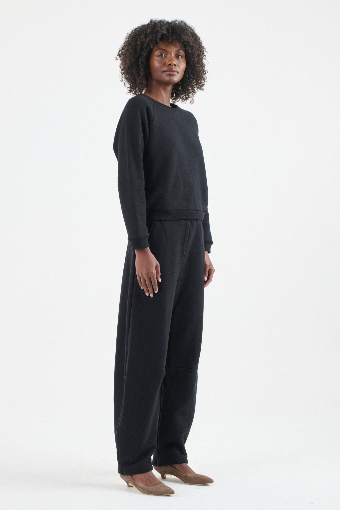 The Arc Lounge Pant in black. On body front side - Jamie Haller
