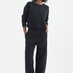 The Arc Lounge Pant in black. On body front - Jamie Haller