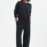 The Arc Lounge Pant in black. On body front - Jamie Haller