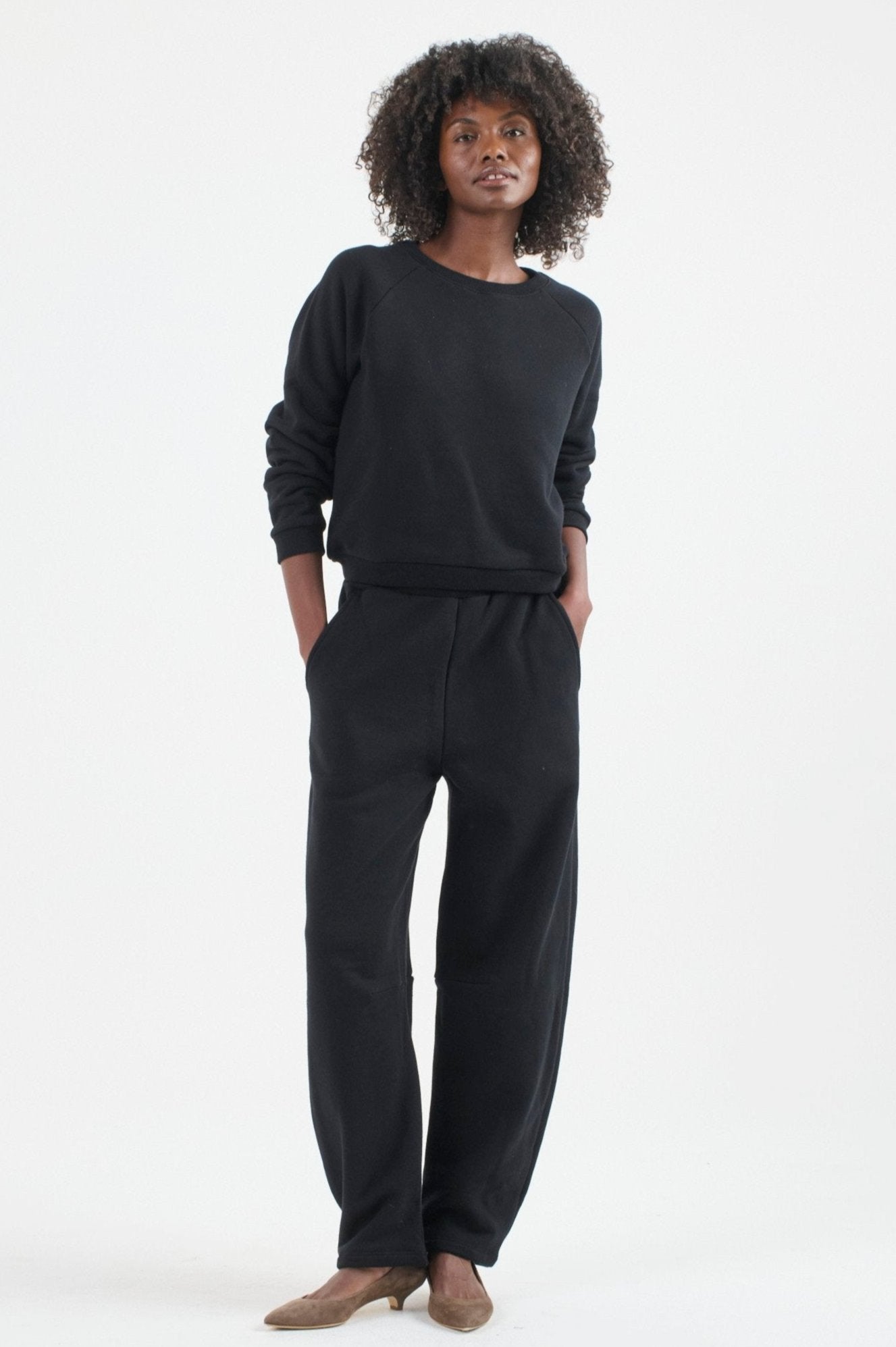 The Arc Lounge Pant in black. On body front - Jamie Haller