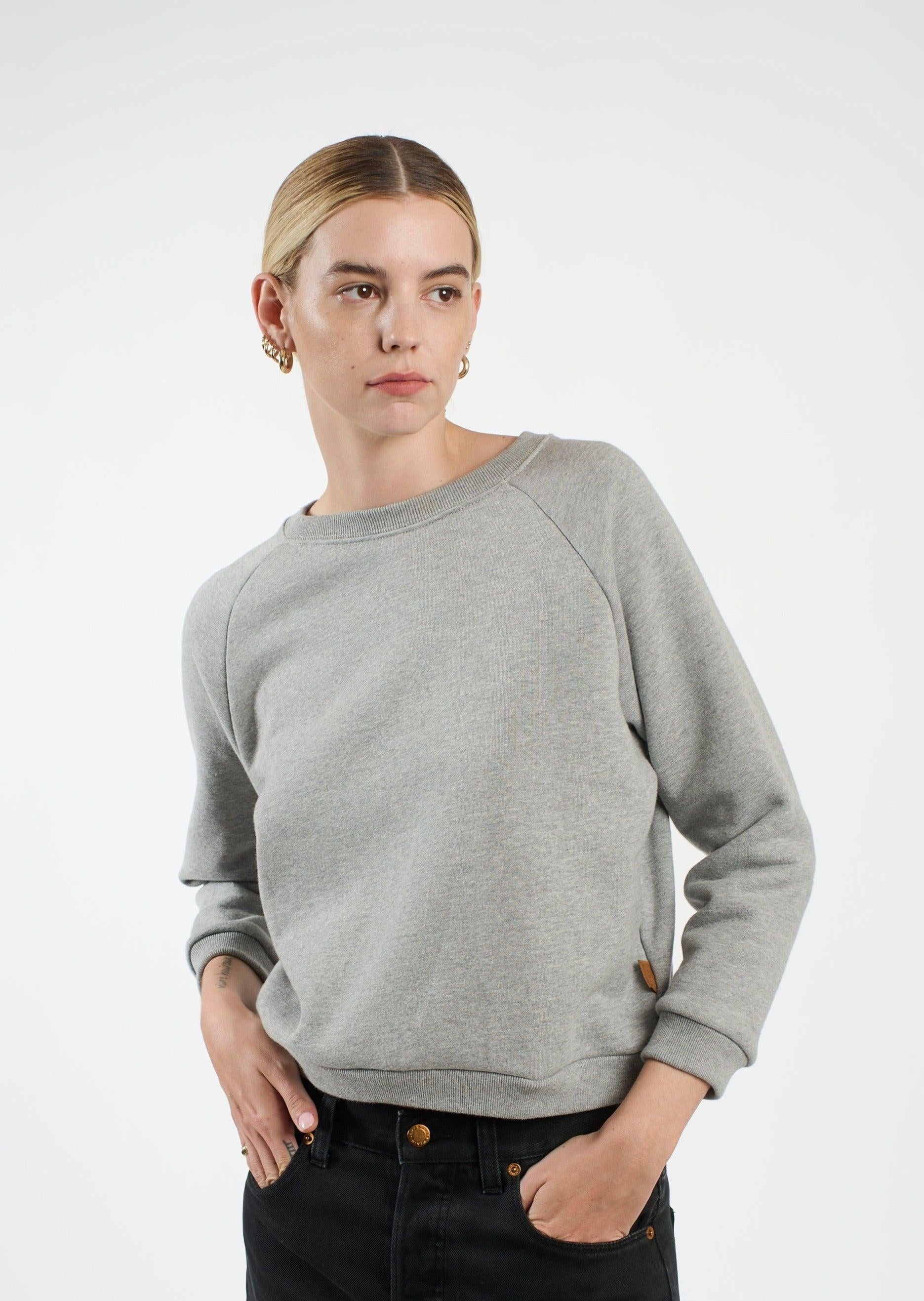 The Daily Sweatshirt in Heather Grey 3/4 Front w/ Hands in Pocket