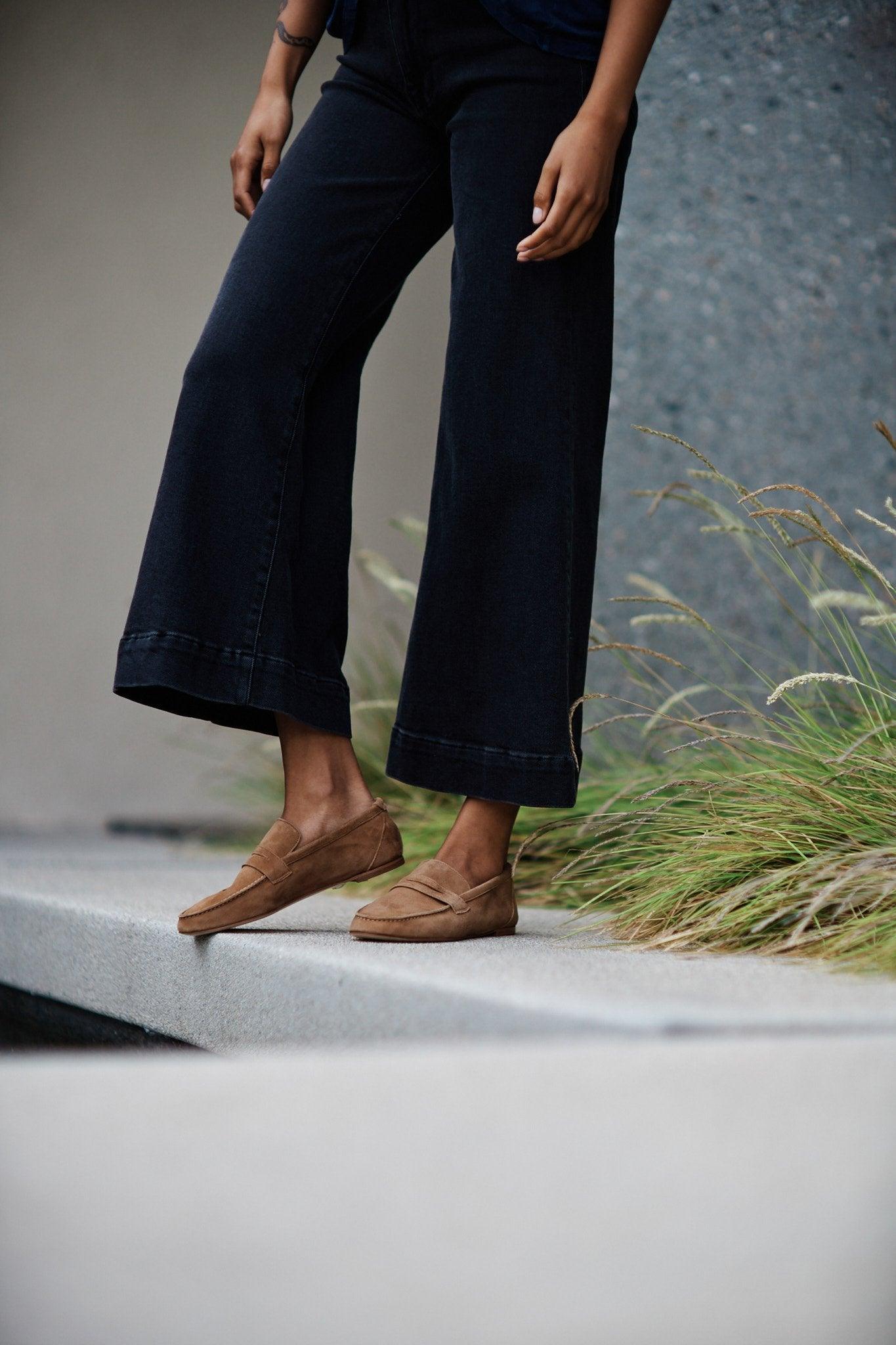 The Penny Loafer in Clove Suede on Figure Standing on Ledge
