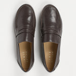 pair of grey penny loafers on a white background
