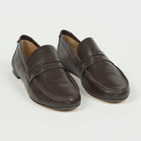 pair of loafers with a white background