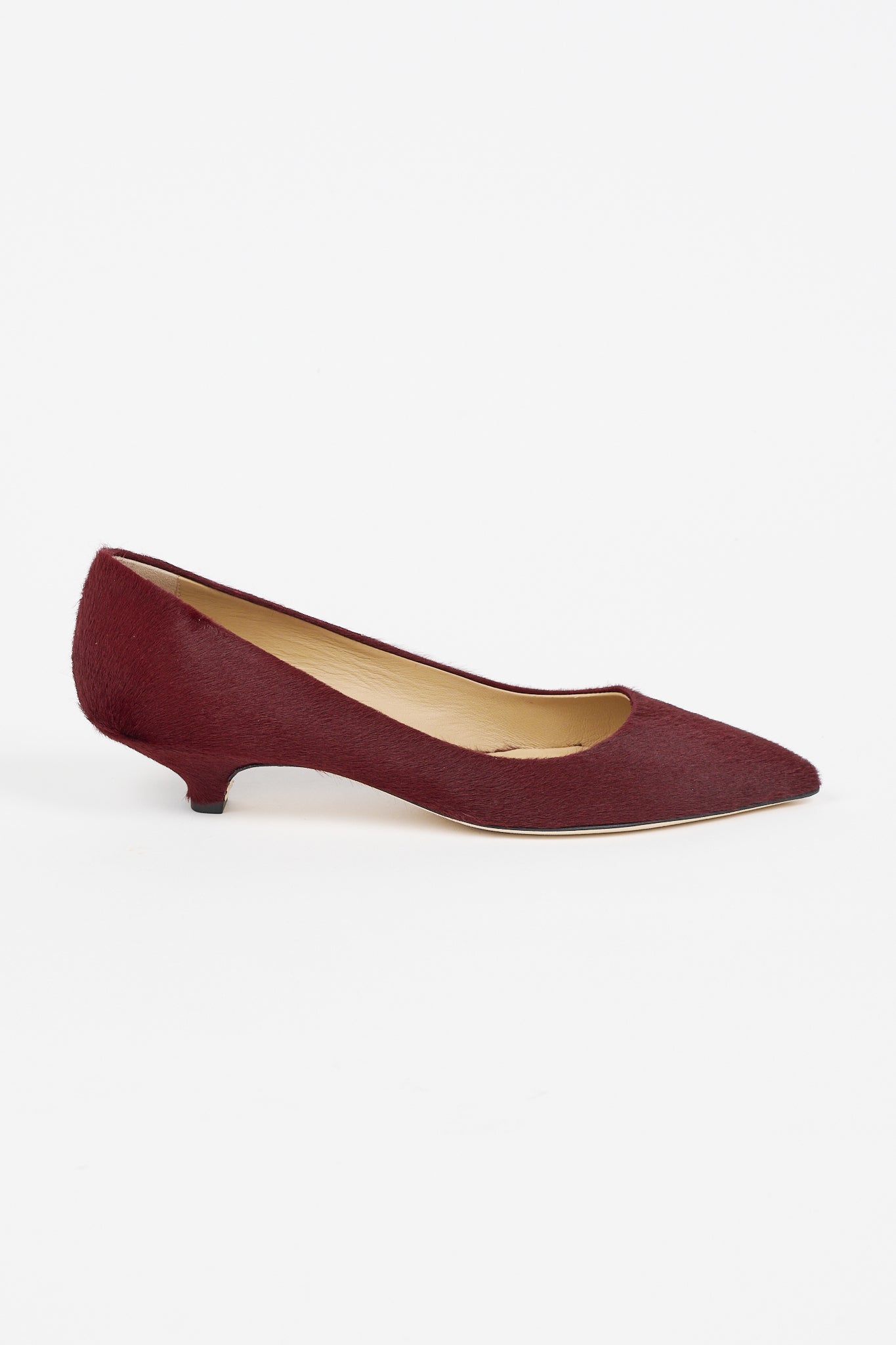 Jamie Haller claret ponyhair pointed toe kitten heel pump shown in profile with a low sculpted heel and soft leather lining