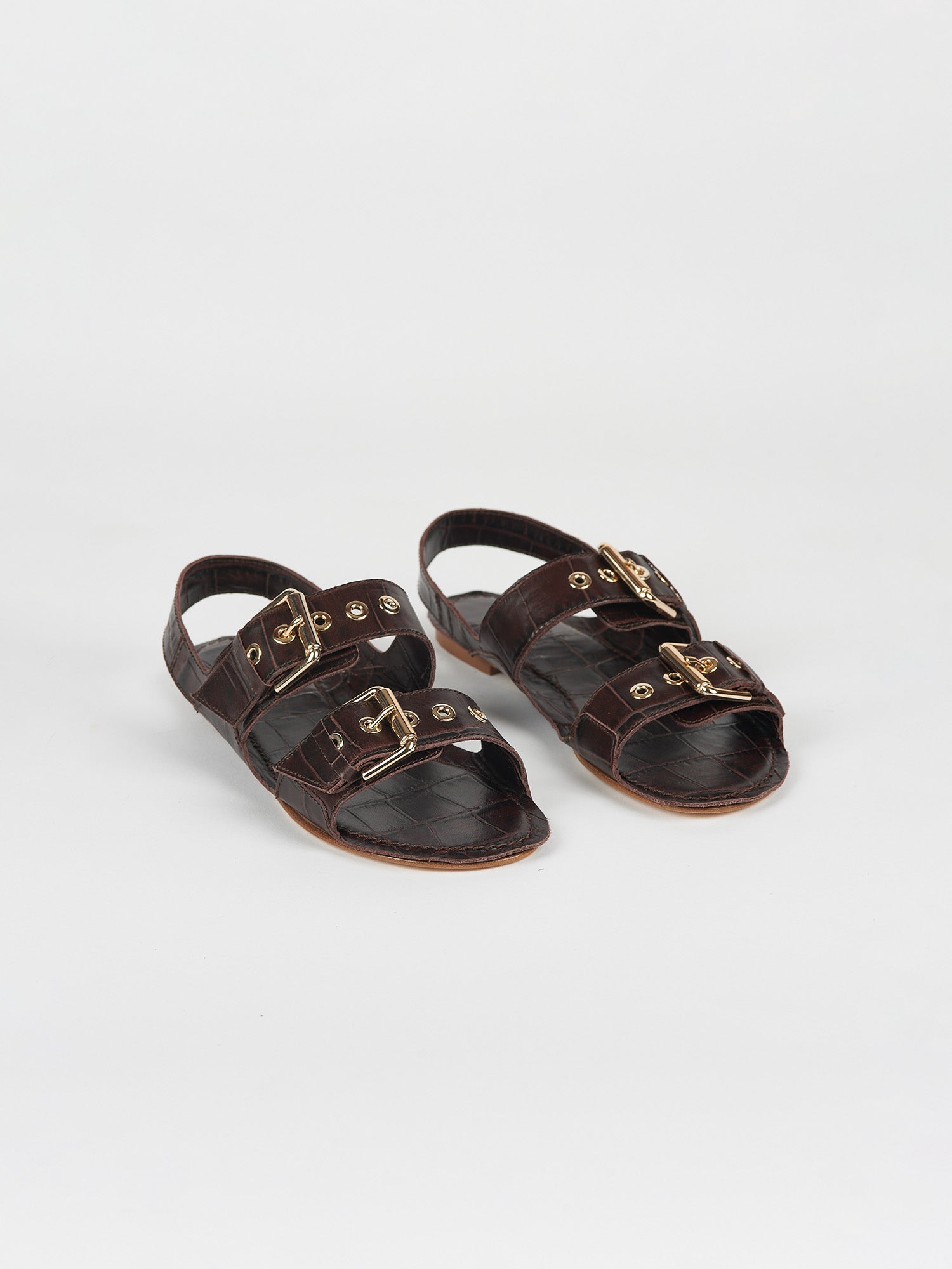The Double Buckle Sandal in Espresso Croc Angled Front View