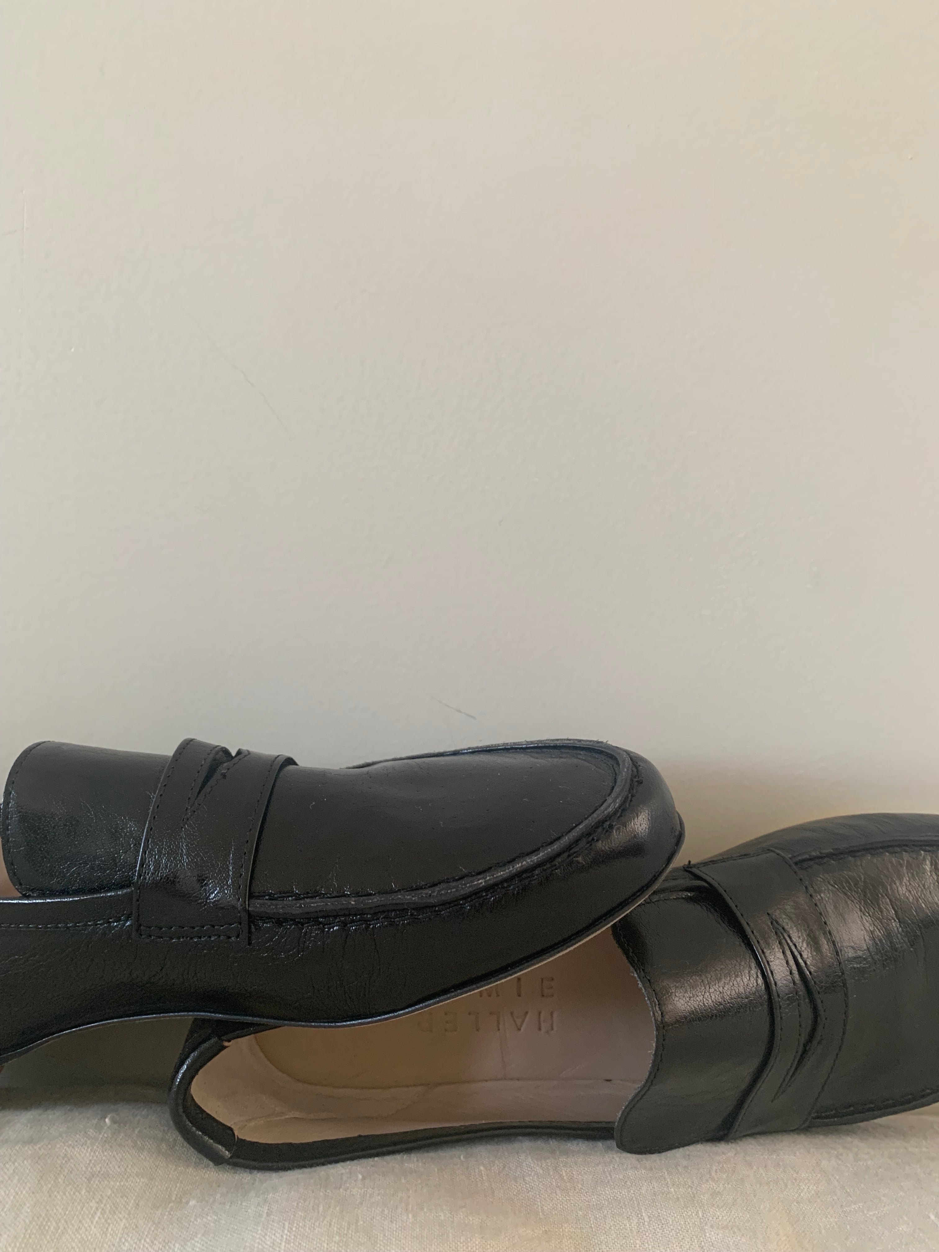 Black Loafers Laying on the Ground