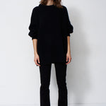 model wearing black sweater and black jeans