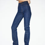 Person wearing blue jeans on a white background