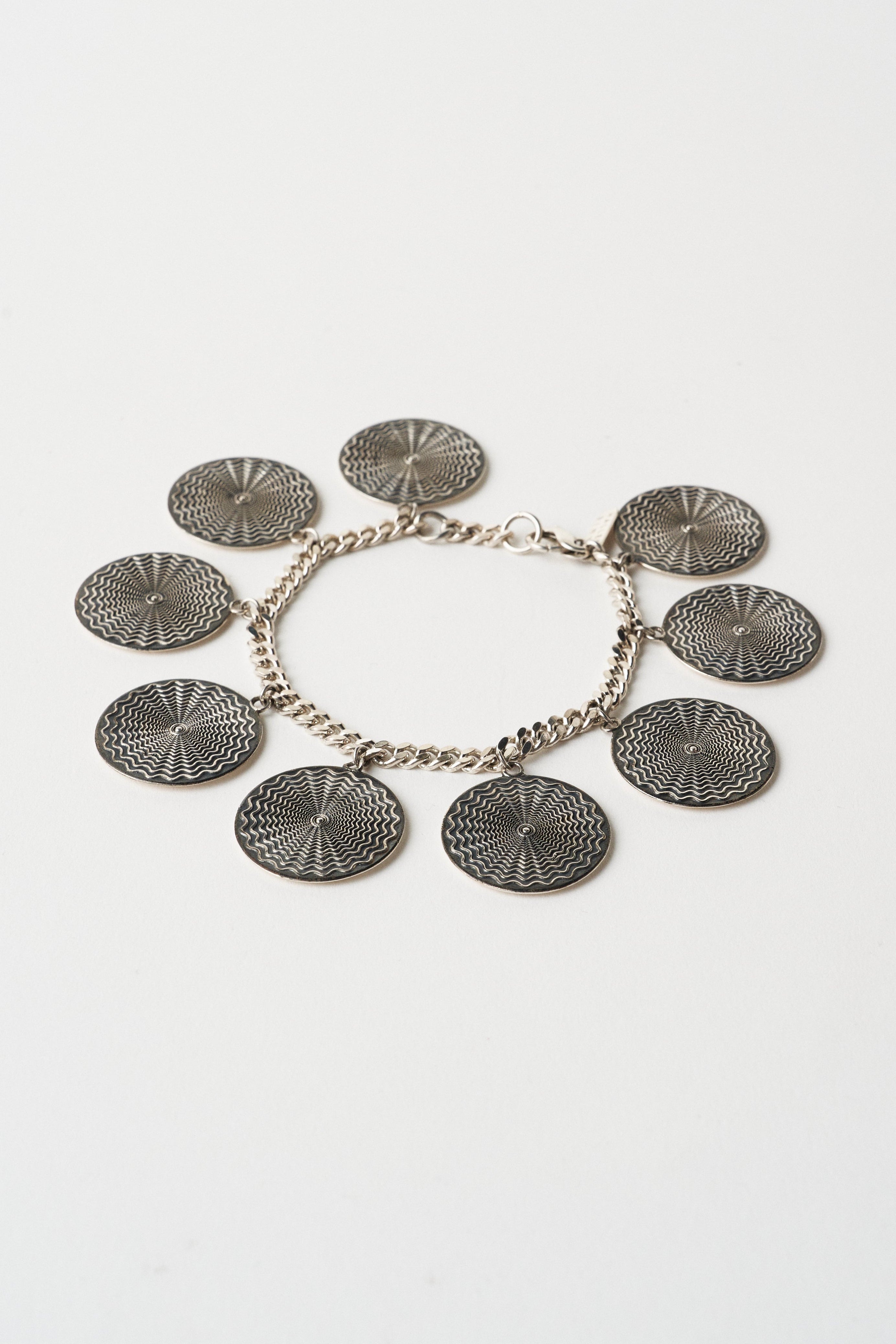 The Chaos Sunburst Charm Bracelet in Sterling Silver