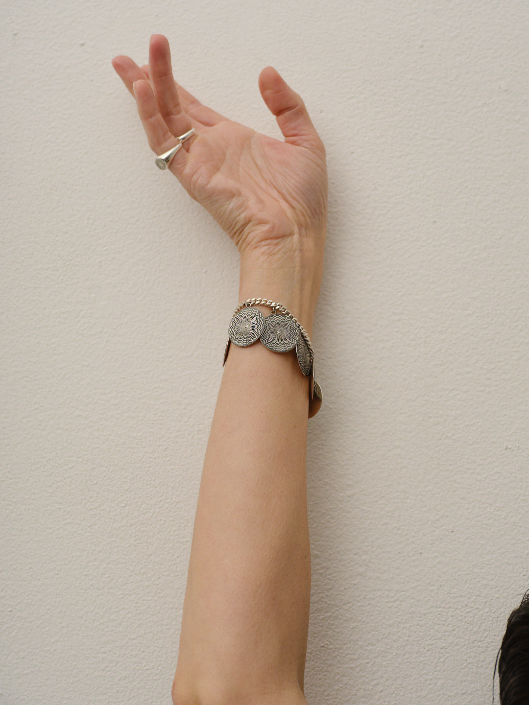 The Chaos Sunburst Charm Bracelet in Sterling Silver