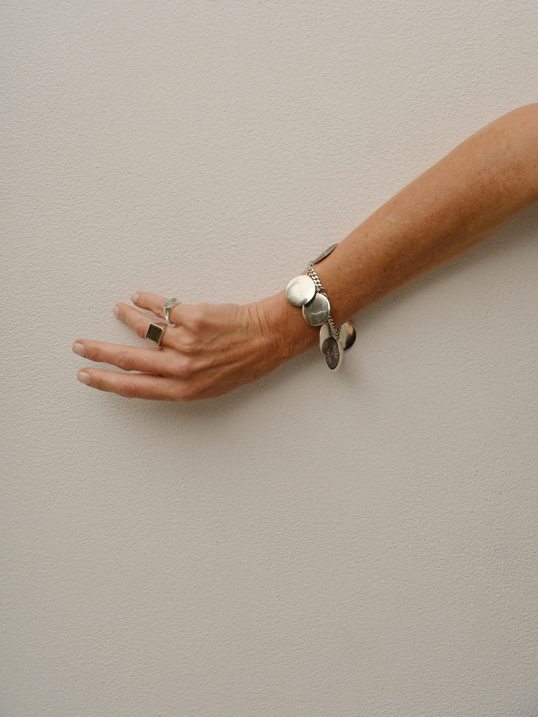 The Chaos Sunburst Charm Bracelet in Sterling Silver