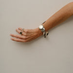 The Chaos Sunburst Charm Bracelet in Sterling Silver