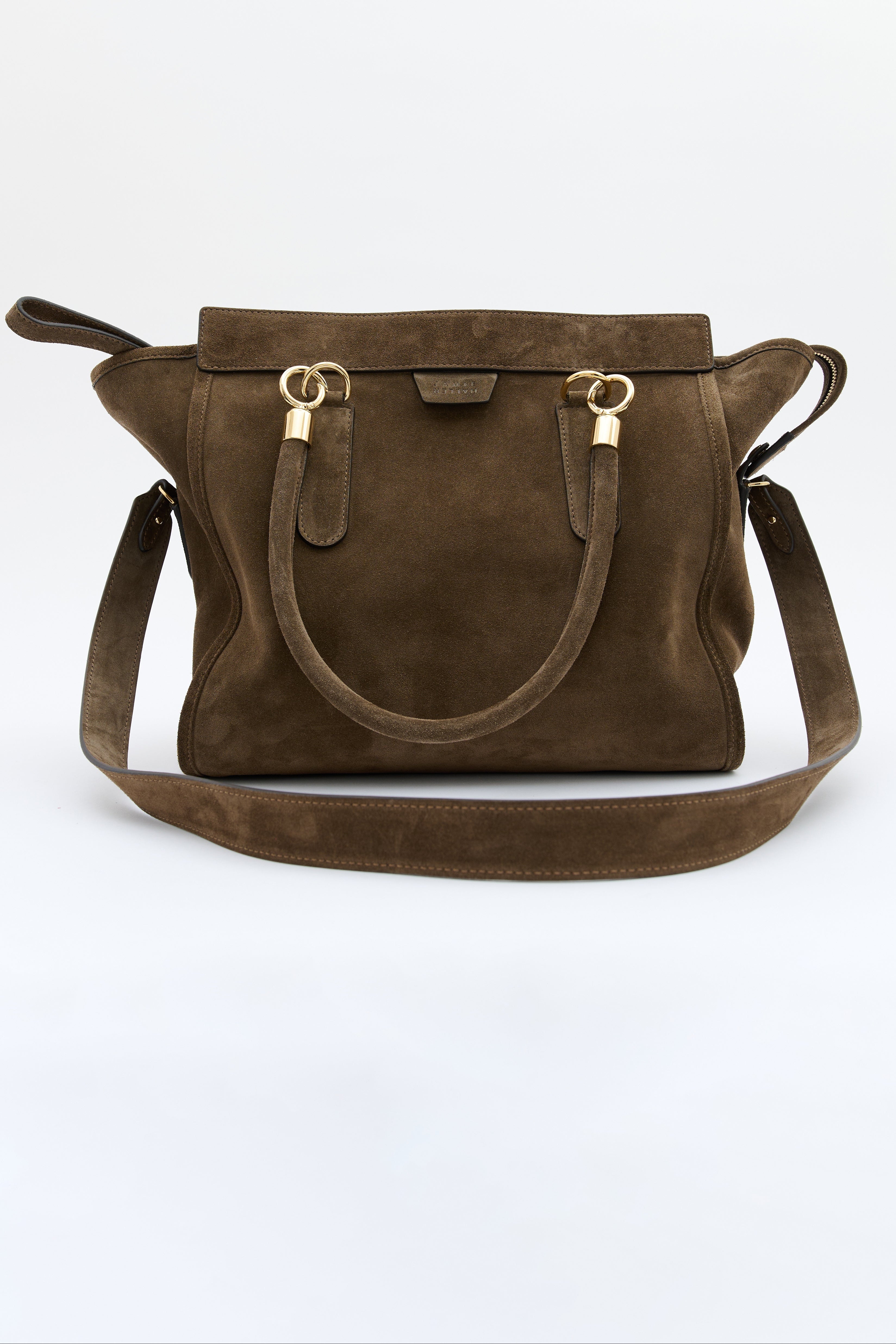 A dark brown suede handbag with gold-tone hardware and a matching shoulder strap, displayed against a clean white background.