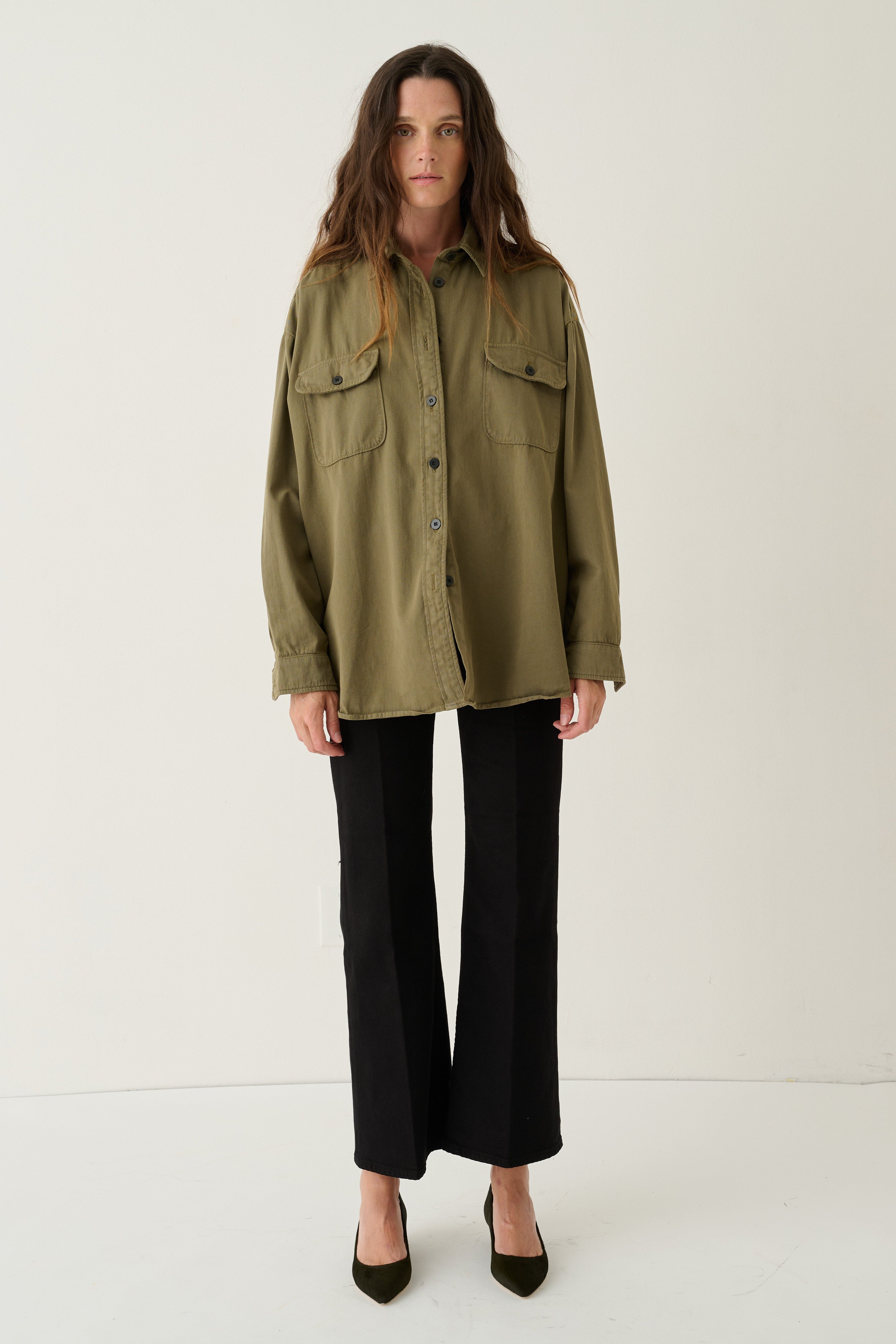 Jamie Haller womens oversized loden shirt with button front and chest pockets styled with black wide leg trousers and pointed heels