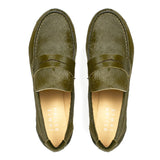 Top view of Jamie Haller moss green ponyhair penny loafers with classic strap detail, leather soles, and soft tan insoles on a white background