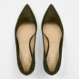 A pair of pointed-toe flats in dark olive green suede, shown from a top-down view on a light gray background. The insoles are beige with the brand name 'Jamie Haller' printed vertically.