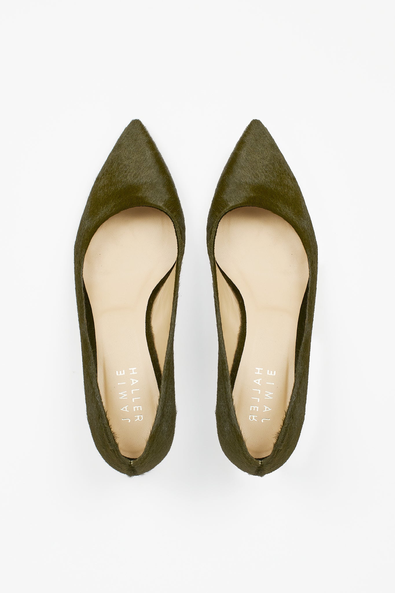 Top view of Jamie Haller moss green ponyhair pointed kitten heels with softly rounded openings and cream leather insoles on a white background