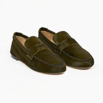 Jamie Haller moss ponyhair penny loafers shown as a pair with moc toe stitching and classic penny straps on a white background