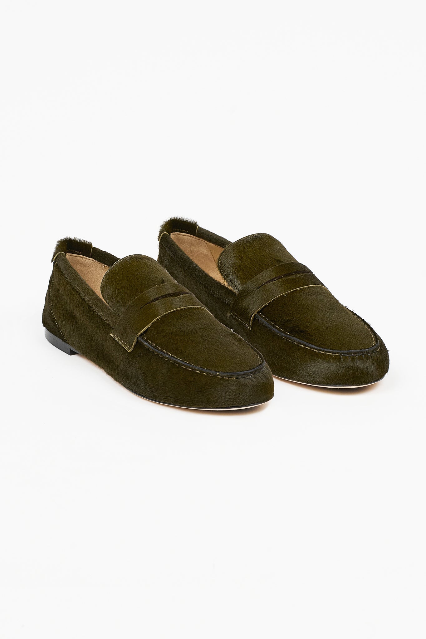 Jamie Haller moss ponyhair penny loafers shown as a pair with moc toe stitching and classic penny straps on a white background