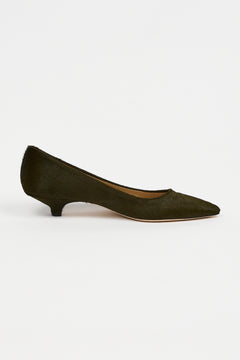 A single black woven Mary Jane flat shoe with a braided strap and pointed toe, shown in profile against a light gray background.