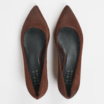 A pair of pointed-toe flat shoes in brown suede, shown from a top-down view on a light gray background. The insoles are black with the brand name 'JAMIE Haller' printed in white.