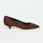 A single black slip-on loafer with a chunky lug sole, shown in a side profile view against a light gray background.
