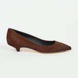 A single black slip-on loafer with a chunky lug sole, shown in a side profile view against a light gray background.