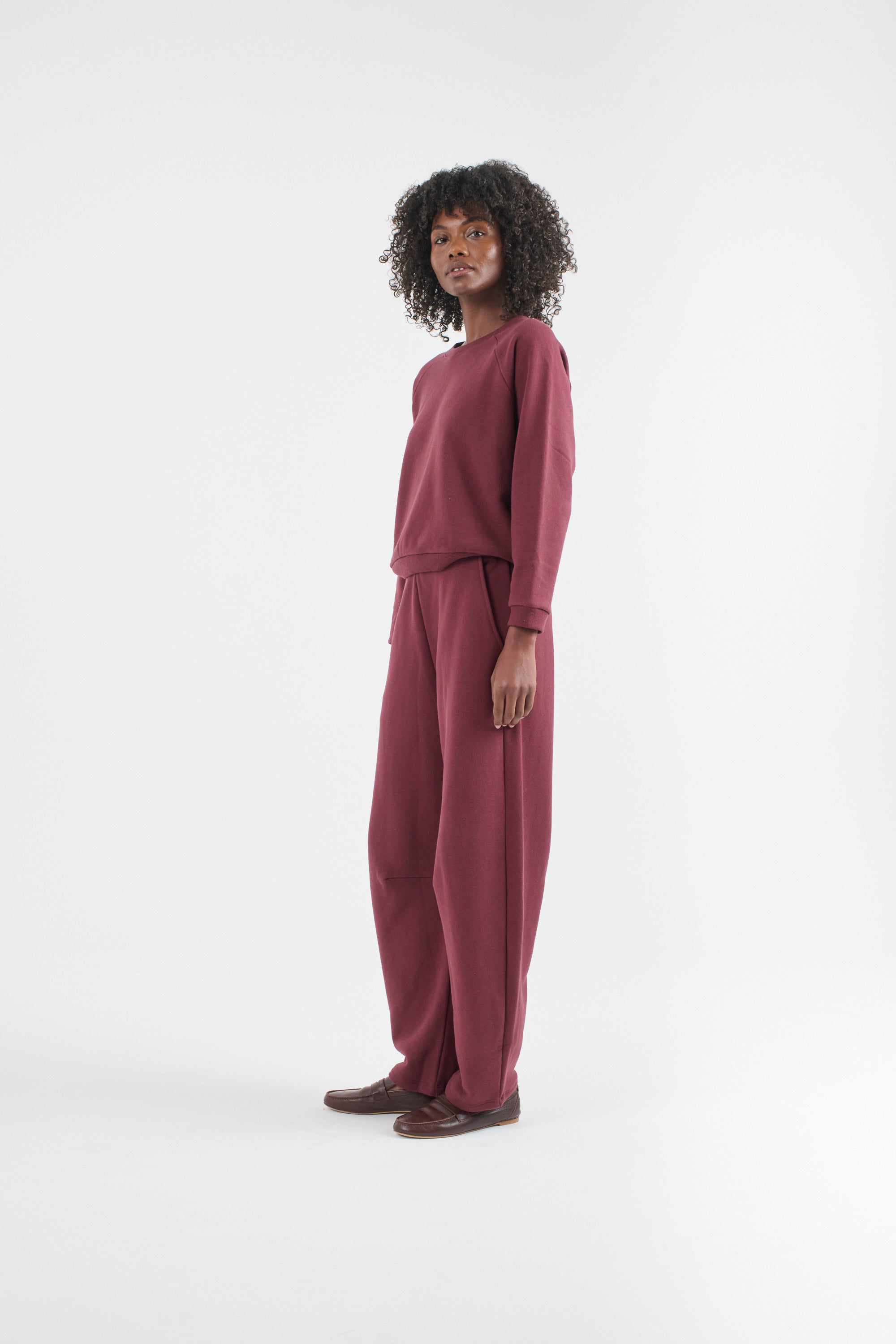 The Daily Sweatshirt in Cherry Cola. On body front side - Jamie Haller