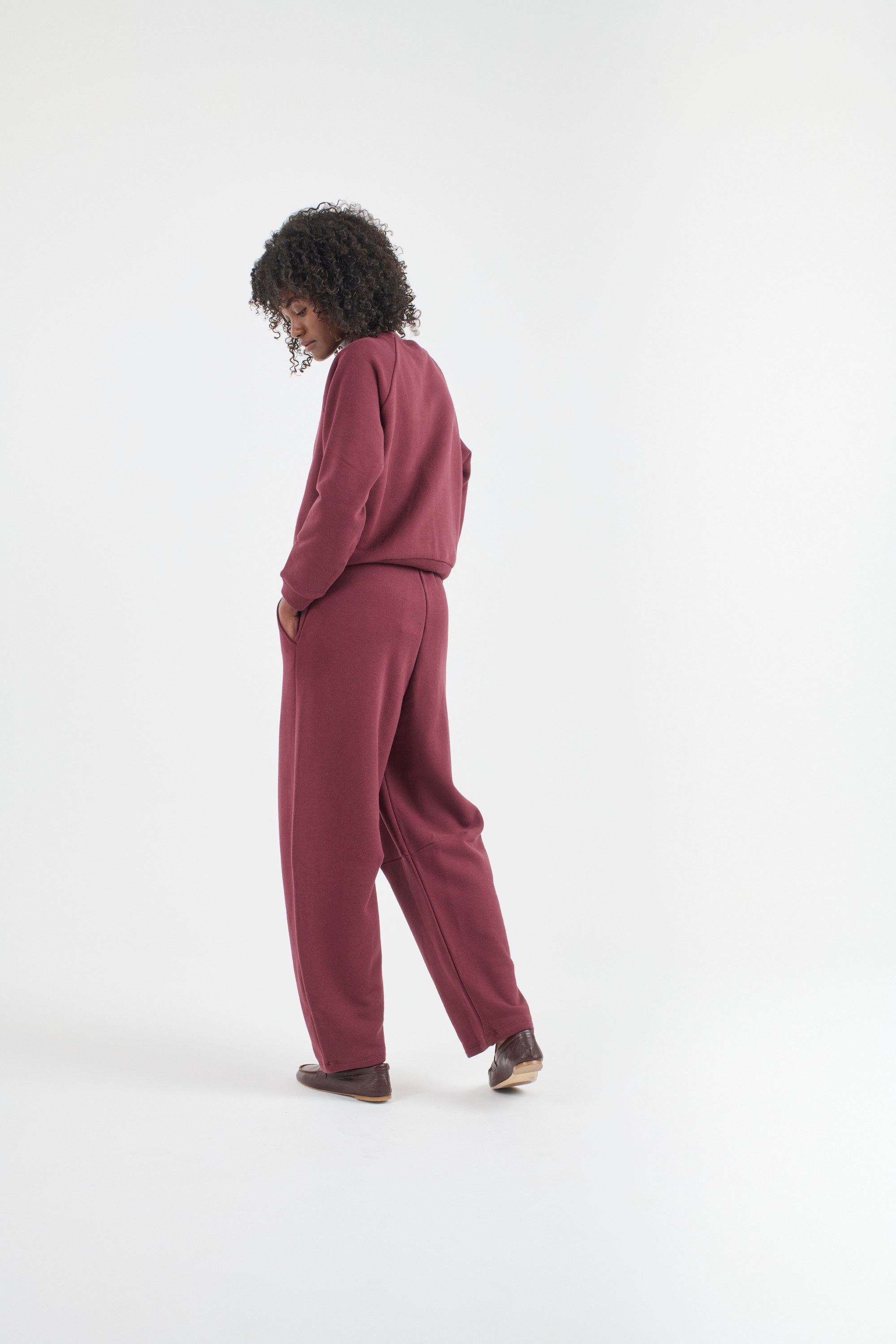 The Daily Sweatshirt in Cherry Cola. On body back side - Jamie Haller