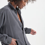 The Essential Silk Blouse in Dark Grey. On body side - Jamie Haller