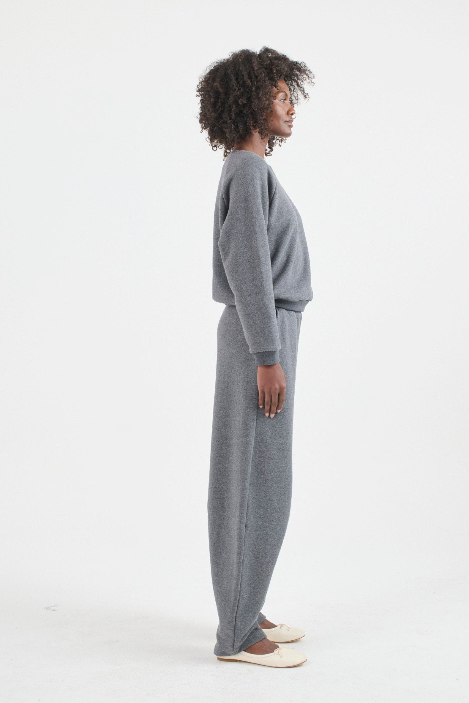 The Arc lounge Pant in deep grey. On body side - Jamie Haller