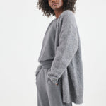 The Arc Lounge Pant in deep grey. On body side - Jamie Haller