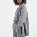 The Arc Lounge Pant in deep grey. On body side - Jamie Haller
