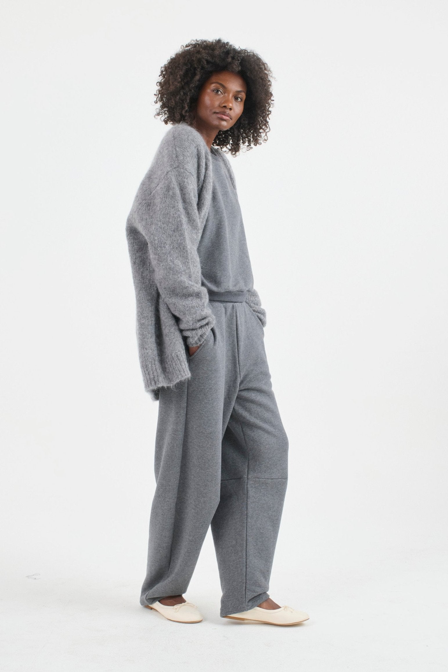 The Arc Lounge Pant in deep grey. On body side - Jamie Haller