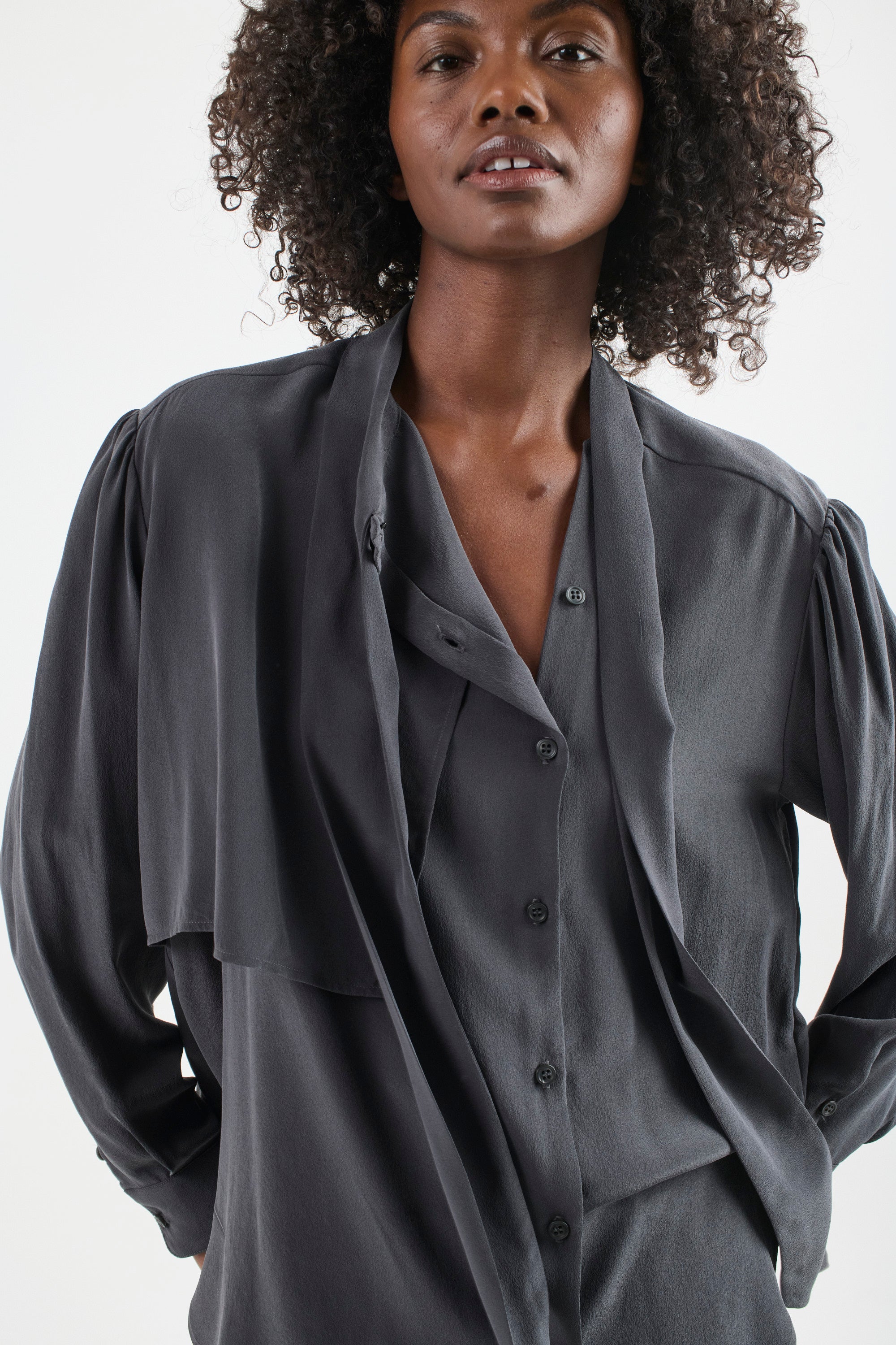 The Brooks Blouse in Dark Grey. On body front - Jamie Haller