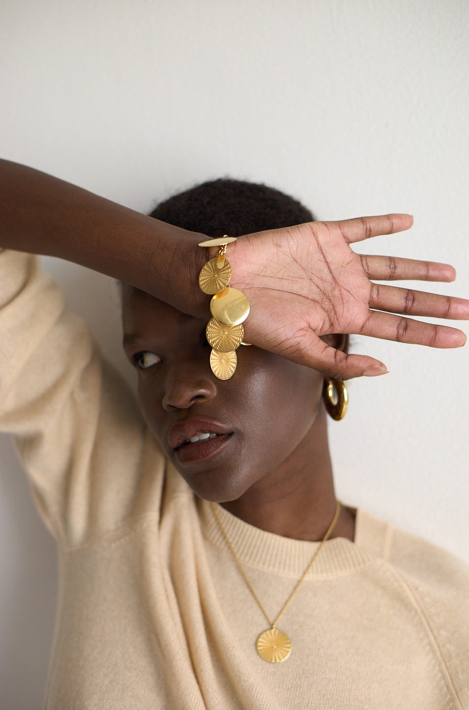 The Chaos Sunburst Charm Bracelet in Gold