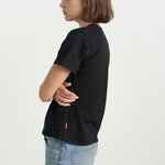 The Chameleon Tee in Black. On body side - Jamie Haller