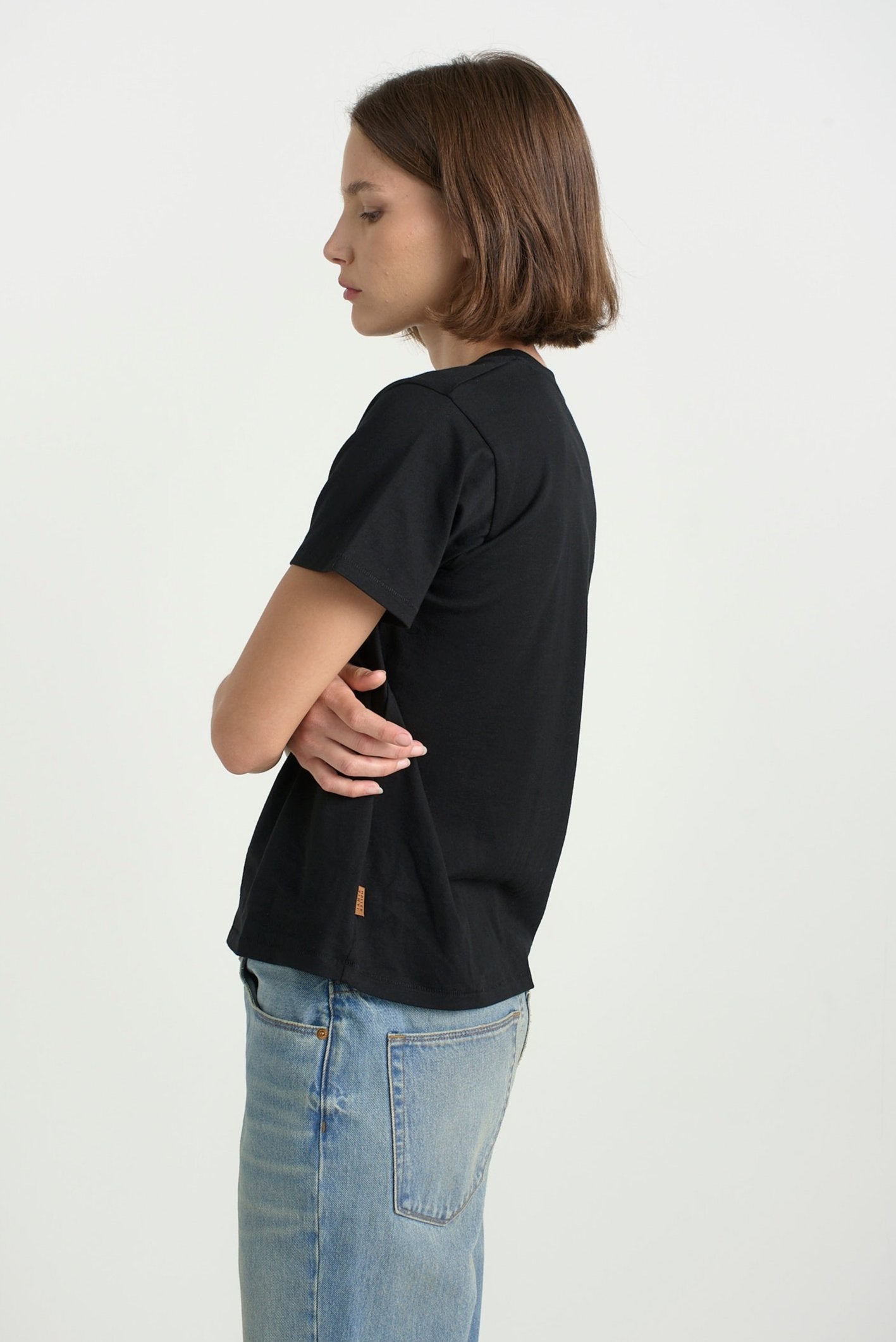 The Chameleon Tee in Black. On body side - Jamie Haller